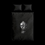 Black duvet cover with a white graphic design and text on a white background