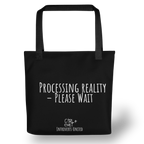 Black tote bag with white text 'Processing Reality - Please Wait' on a BLACK background