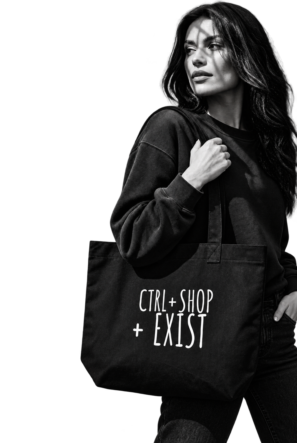 A woman in a black sweatshirt and jeans carries a black canvas tote bag with the white text 'CTRL+SHOP + EXIST' 