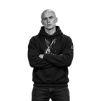 A man wearing a black pullover hoodie with a white rabbit graphic on the front and a small white logo on the left sleeve, posed against a solid white background.