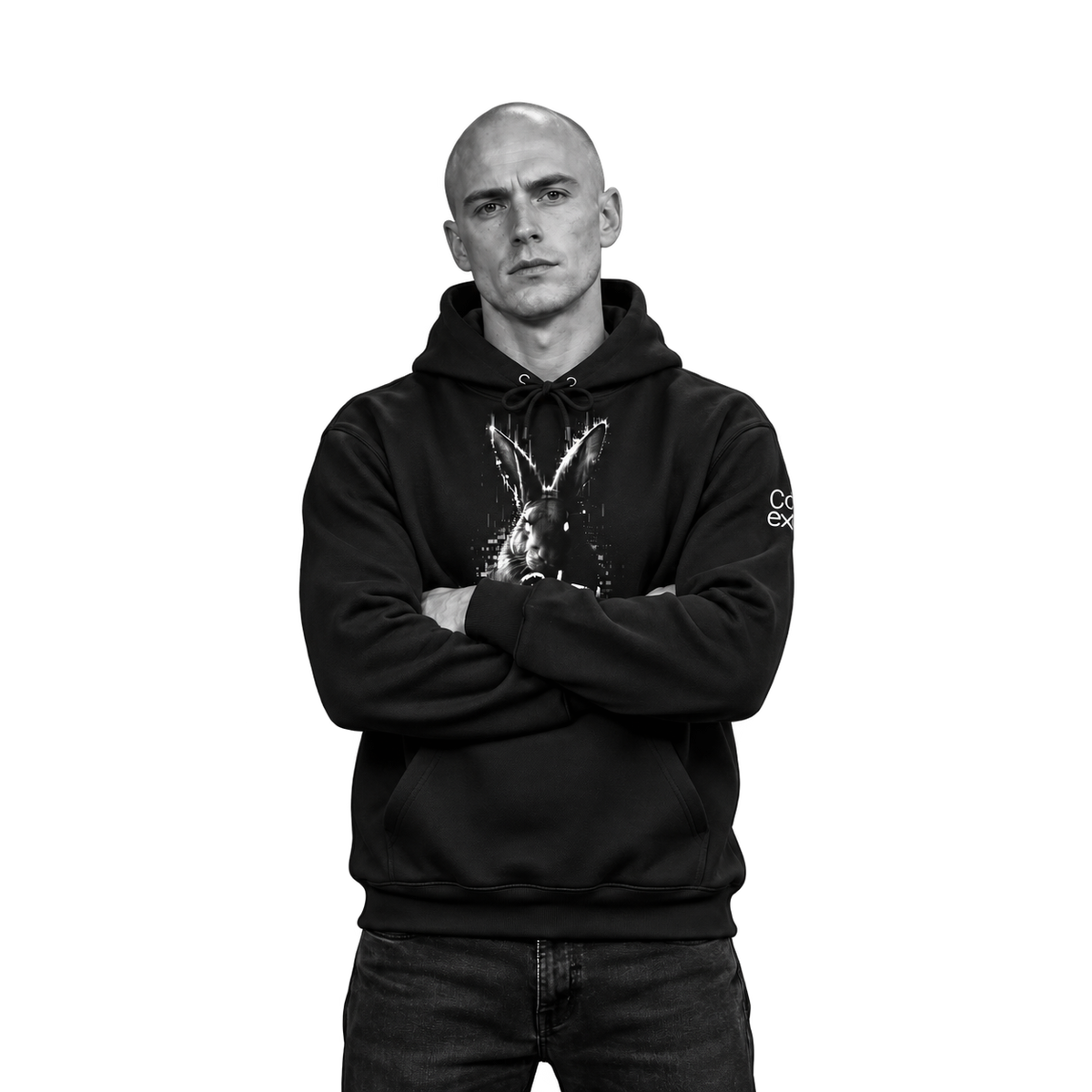 A man wearing a black pullover hoodie with a white rabbit graphic on the front and a small white logo on the left sleeve, posed against a solid white background.