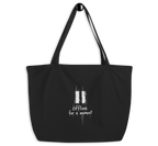 Black organic cotton tote bag with a white “Offline for a moment” graphic,