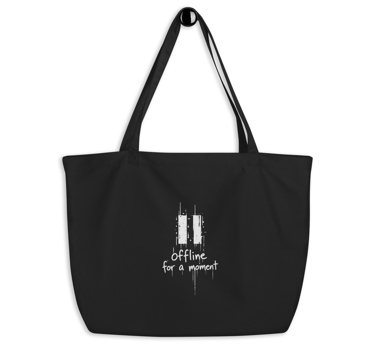 Black organic cotton tote bag with a white “Offline for a moment” graphic,