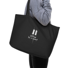 Black organic cotton tote bag with a white “Offline for a moment” graphic, carried over the shoulder.